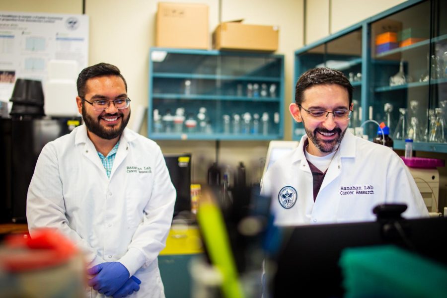 Undergraduate biology lab manager Diego de la Torre, left, looks at research results with William Ranahan, chair of the Biology and Chemistry Department at Oral Roberts University.