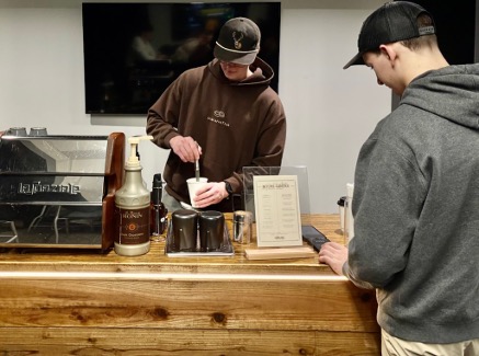 ORU junior Levi Church prepares a drink for a customer at the Divine Coffee Co. in the Stovall Center for Entrepreneurship. 